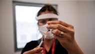 A nurse prepares a dose of the Pfizer-BioNTech coronavirus disease (COVID-19) vaccine at Ankara City Hospital in Ankara, Turkey, April 2, 2021. REUTERS/Cagla Gurdogan