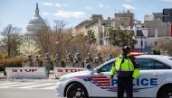 Members of the National Guard and police block off Constitution Avenue near the U.S. Capitol in Washington, D.C., where two Capitol police officers were struck by a vehicle that rammed into a barricade on Friday. Photo for The Washington Post by Amanda An