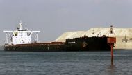A ship is seen after sailing through Suez Canal as traffic resumes after a container ship that blocked the waterway was refloated, in Ismailia, Egypt, March 30, 2021. REUTERS/Hanaa Habib