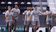 Al Sadd players celebrate after defeating Al Gharafa yesterday.