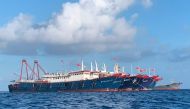 Chinese vessels, believed to be manned by Chinese maritime militia personnel, are seen at Whitsun Reef, South China Sea on March 27, 2021. Philippine Coast Guard/National Task Force-West Philippine Sea/Handout via Reuters 