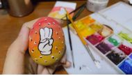 An Easter egg painted with a three-finger salute, as part of a campaign for an Easter egg protest against military rule, is seen in this picture posted on social media in Yangon, Myanmar April 3, 2021. Photo obtained by Reuters.