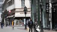 People walks in a shopping street as the shops reopen amid the coronavirus disease (COVID-19) pandemic in downtown Budapest, Hungary, April 7, 2021. REUTERS/Bernadett Szabo