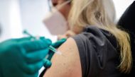 A woman receives a dose of the Pfizer-BioNTech coronavirus disease (COVID-19) vaccine in a doctors' practice in Berlin, Germany, April 7, 2021. Reuters/Hannibal Hanschke