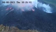 Smoke spews from the glowing dome of the La Soufriere volcano in Saint Vincent and the Grenadines, April 8, 2021, in this image obtained from the University of West Indies Seismic Research Center. Courtesy of The UWI Seismic Research Centre/ via REUTERS.