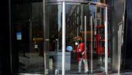 A worker prepares for the reopening of a business, as the coronavirus disease (COVID-19) lockdown restrictions begin to ease, in London, Britain, April 9, 2021. REUTERS/Hannah McKay