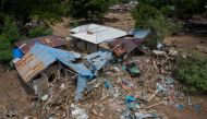 An aerial picture shows damaged houses following flash floods triggered by tropical cyclone Seroja in East Flores, East Nusa Tenggara province, Indonesia April 7, 2021, in this photo taken by Antara Foto/Aditya Pradana Putra via Reuters