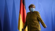 German Chancellor Angela Merkel leaves after giving a statement, amid the coronavirus disease (COVID-19) outbreak, in Berlin, Germany, April 13, 2021. REUTERS/Annegret Hilse/Pool
