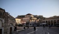 People make their way on Monastiraki square, amid the coronavirus disease (COVID-19) pandemic, in Athens, Greece, March 10, 2021. Picture taken March 10, 2021. REUTERS/Louiza Vradi