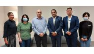 Officials of Doha Oasis Quest and Levtech Consulting pose for a group photo.
