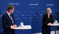 Tanja Erichsen of the Danish Medicines Agency (R) and Director of the National Board of Health, Soeren Brostroem explain why the AstraZeneca vaccine is stopped in Denmark during a press briefing in Copenhagen, Denmark, April 14, 2021. Philip Davali/Ritzau