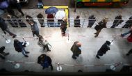 People queue to receive the AstraZeneca coronavirus disease (COVID-19) vaccine at a new mass vaccination centre in WiZink sports arena in Madrid, Spain, April 9, 2021. REUTERS/Sergio Perez/File Photo