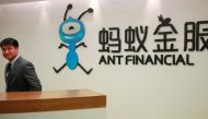 An employee stands next to the logo of Ant Financial Services Group, Alibaba's financial affiliate, at its headquarters in Hangzhou, Zhejiang province, China January 24, 2018. Reuters/Shu Zhang/File Photo