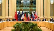 European External Action Service (EEAS) Deputy Secretary General Enrique Mora and Iranian Deputy at Ministry of Foreign Affairs Abbas Araghchi wait for the start of a meeting of the JCPOA Joint Commission in Vienna, Austria on April 17, 2021. (EU Delegati