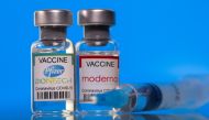 Vials with Pfizer-BioNTech and Moderna coronavirus disease (COVID-19) vaccine labels are seen in this illustration picture taken March 19, 2021. REUTERS/Dado Ruvic

