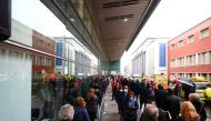 People queue to receive the AstraZeneca coronavirus disease (COVID-19) vaccine at a new mass vaccination centre in WiZink sports arena in Madrid, Spain, April 9, 2021. REUTERS/Sergio Perez/File Photo