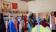 Babacar Kor, 30, from a Baye Fall community, a branch of the Muslim Mouride brotherhood, is pictured at their shop in Ndem village, Senegal April 6, 2021. Reuters/Zohra Bensemra