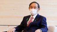 Japan's Prime Minister Yoshihide Suga wearing a face mask meets COP26 President Alok Sharma at the prime minister's official residence in Tokyo, Japan April 19, 2021. Rodrigo Reyes Marin/Pool via REUTERS
