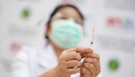 A healthcare worker prepares a syringe with a dose of Sinovac's COVID-19 vaccine at the Bang Khun Thian Geriatric Hospital in Bangkok, Thailand April 21, 2021. REUTERS/Athit Perawongmetha/File Photo