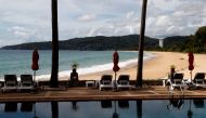 An empty hotel and beach which have opened for visitors is seen in Karon, Phuket Island, Thailand March 31, 2021. Picture taken March 31, 2021. REUTERS/Jorge Silva