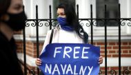 File photo: A woman holds a sign as she takes part in a demonstration in support of jailed Russian opposition politician Alexei Navalny outside the Russian Embassy in London, Britain, April 21, 2021. Reuters/Henry Nicholls/File Photo