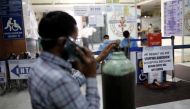 A man stands next to a notice outside a hospital, amidst the spread of the coronavirus disease (COVID-19) in New Delhi, India, April 22, 2021. Picture taken April 22, 2021. REUTERS/Adnan Abidi

