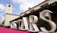 A crew member looks over a background element for the red carpet at Union Station, one of the locations for the 93rd Academy Awards in Los Angeles, California, U.S. April 24, 2021. Picture taken April 24, 2021. Chris Pizzello/Pool via REUTERS