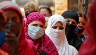 Women wait in line to cast their votes at a polling station during the seventh phase of West Bengal state election, amidst the spread of the coronavirus disease (COVID-19), in Kolkata, India, April 26, 2021. Reuters/Rupak De Chowdhuri