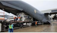 An oxygen tank is loaded into an aircraft to help hospitals in India running out of oxygen supplies amid coronavirus disease (COVID-19) outbreak, at the tarmac of Changi Airport in Singapore April 24, 2021 in this picture taken April 24, 2021 obtained fro