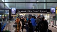 File photo: People queue to enter terminal 2, as tighter rules for international travellers start, at Heathrow Airport, amid the spread of the coronavirus disease (COVID-19) pandemic, London, Britain, January 18, 2021. Reuters /Henry Nicholls/File Photo