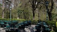Tables and chairs are pictured next to a closed restaurant as the coronavirus disease (COVID-19) lockdown continues in Vienna, Austria April 23, 2021. REUTERS/Leonhard Foeger/File Photo