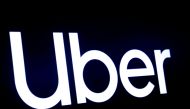 A screen displays the company logo for Uber Technologies Inc at the New York Stock Exchange (NYSE) in New York, U.S., May 10, 2019. REUTERS/Brendan McDermi/File Photo