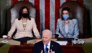 US Vice president Kamala Harris and Speaker of the House Nancy Pelosi listen as U.S. President Joe Biden addresses a joint session of Congress in the House chamber of the US Capitol in Washington, U.S., April 28, 2021. Doug Mills/Pool via Reuters