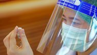 A health worker prepares to administer the Sinovac coronavirus disease (COVID-19) vaccine at the Samut Sakhon hospital in Samut Sakhon province, Thailand, February 28, 2021. REUTERS/Athit Perawongmetha/File Photo