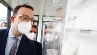 German Health Minister Jens Spahn visits the Allergopharma plant in Reinbek near Hamburg, Germany, April 30, 2021, as the they started the Pfizer/BioNTech Covid-19 vaccine production. Christian Charisius/Pool via REUTERS