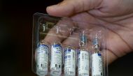 FILE PHOTO: A paramedic holds a pack of used and unused vials of Russia's Sputnik V coronavirus disease (COVID-19) vaccine at a private hospital in Karachi, Pakistan April 4, 2021. REUTERS/Akhtar Soomro