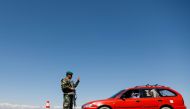 FILE PHOTO: An Afghan National Army soldier stands guard at a checkpoint on the outskirts of Kabul, Afghanistan April 21, 2021. REUTERS/Mohammad Ismail/File Photo