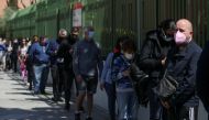 Voters, wearing protective face masks and keeping social distance, queue to access a polling station during Madrid's Regional elections, in Madrid, Spain, May 4, 2021. Reuters/Susana Vera