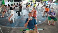People from Klong Toey community wait to get a coronavirus disease (COVID-19) test, in Bangkok, Thailand, May 4, 2021. REUTERS/Soe Zeya Tun