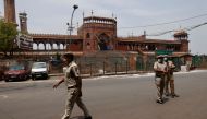 Policemen stand in front of Jama Masjid or Grand Mosque on Jumat-ul-Vida or the last Friday of the holy fasting month of Ramadan, during a lockdown to limit the spread of the coronavirus disease (COVID-19), in the old quarters of Delhi, India, May 7, 2021