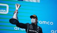 May 9, 2021 Mercedes' Lewis Hamilton celebrates on the podium with a trophy after winning the race Pool via REUTERS/Emilio Morenatti