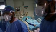 Geetika, 45, who is suffering from coronavirus disease (COVID-19), receives treatment as a Syringe Infusion Pump, donated by France is seen next to her bed, inside the emergency room of Safdarjung Hospital in New Delhi, India, May 7, 2021. REUTERS/Adnan A