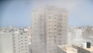 Dust and smoke rise following an Israeli air strike amid a flare-up of Israeli-Palestinian violence, in Gaza City May 11, 2021. REUTERS/Suhaib Salem