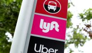 A sign marks a rendezvous location for Lyft and Uber users at San Diego State University in San Diego, California, U.S., May 13, 2020. REUTERS/Mike Blake/File Photo