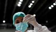 FILE PHOTO: A healthcare worker prepares a dose of Sinovac's vaccine for the coronavirus disease (COVID-19) during a mass vaccination for medical workers at the Istora Senayan stadium in Jakarta, Indonesia, February 4, 2021. REUTERS/Willy Kurniawan/File P