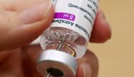 FILE PHOTO: A medical worker prepares a dose of Oxford/AstraZeneca's COVID-19 vaccine at a vaccination centre in Antwerp, Belgium March 18, 2021. REUTERS/Yves Herman/File Photo
