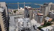 A picture taken with a drone shows the remains of a tower building which was destroyed in Israeli air strikes, amid a flare-up of Israeli-Palestinian violence, in Gaza City May 12, 2021. REUTERS/Mohammed Salem