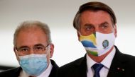 BRAZIL's Health Minister Marcelo Queiroga and BRAZIL's President Jair Bolsonaro arrive for a ceremony of release of resources for Primary Health Care in combat of the coronavirus disease (COVID-19), at the Planalto Palace in Brasilia, BRAZIL May 11, 2021.