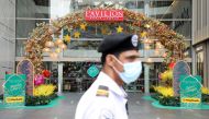 A security guard stands guard outside a closed mall during a lockdown due to the coronavirus disease (COVID-19) pandemic, in Kuala Lumpur, Malaysia, May 11, 2021. REUTERS/Lim Huey Teng/File Photo