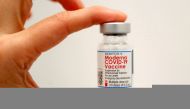 A healthcare worker holds a vial of the Moderna COVID-19 Vaccine at a pop-up vaccination site operated by SOMOS Community Care during the coronavirus disease (COVID-19) pandemic in Manhattan in New York City, New York, U.S., January 29, 2021. REUTERS/Mike